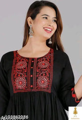 Rayon embroidered kurtis with three-quarter sleeves, intricate Indian design on display